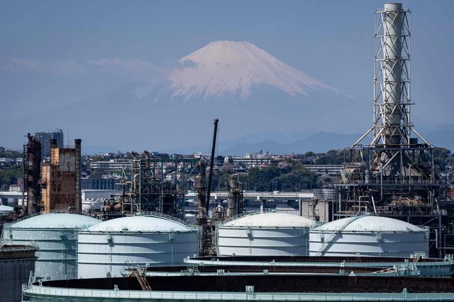 Storage tanks are seen at an oil refinery as Mount Fuji looms in the background in Yokohama, Kanagawa prefecture, on 8 April 2026. (Yuichi Yamazaki/AFP)