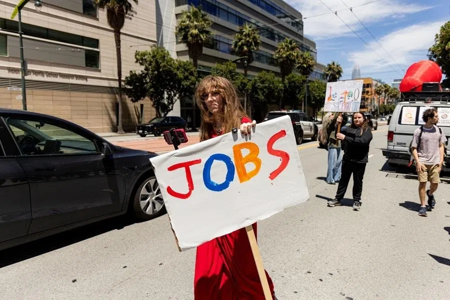 Demonstrators hold signs during a protest against artificial intelligence (AI) outside Open AI headquarters offices in San Francisco, California, US, on 11 July 2026.