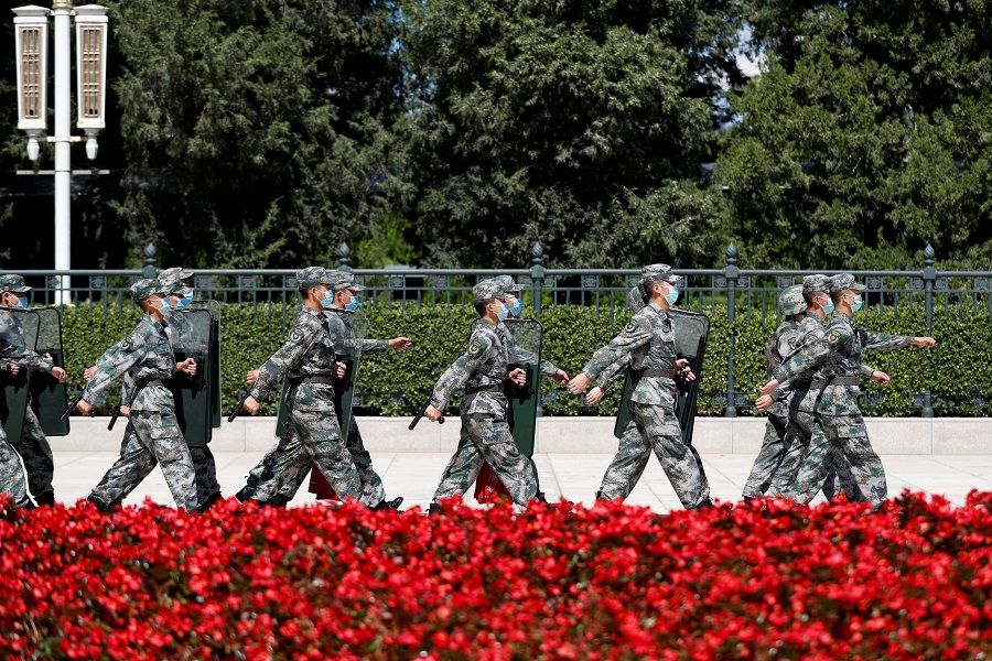 Soldiers of the People's Liberation Army (PLA) march outside the Great Hall of the People in Beijing, China, 8 September 2020. (Carlos Garcia Rawlins/Reuters)