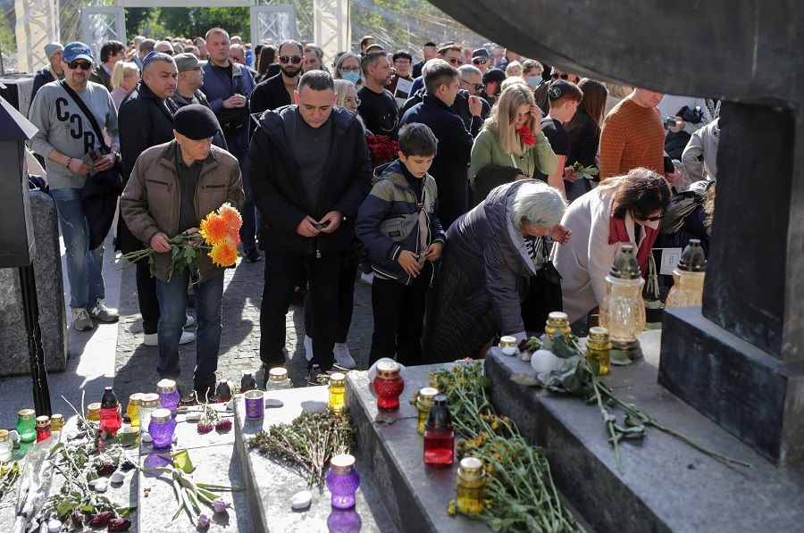 People attend the March of Remembrance to commemorate the victims of Babyn Yar (Babiy Yar), one of the biggest single massacres of Jews during the Nazi Holocaust, on the 80th anniversary in Kyiv, Ukraine, 3 October 2021. (Anastasia Vlasova/Reuters)