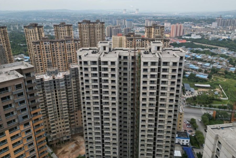 An aerial view shows unfinished residential buildings of the Gaotie Wellness City complex in Tongchuan, Shaanxi province, China, on 12 September 2023. (Xiaoyu Yin/Reuters)