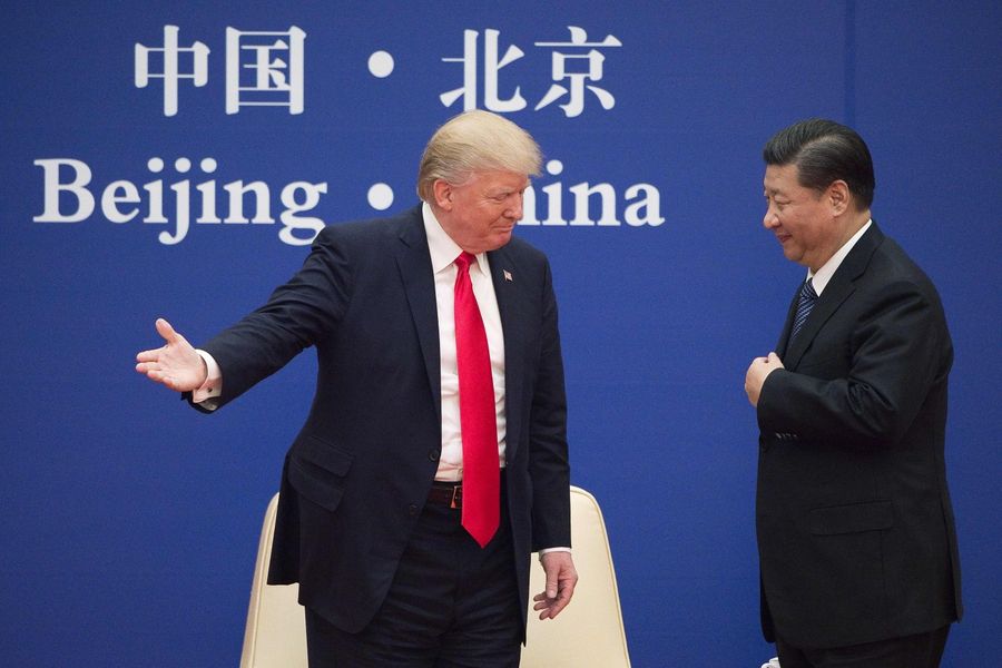 A deep mistrust is dividing the two great powers, and China is frustrated with its failure to become integrated into the existing American-led world order. In this file photo taken on 8 November 2017, US President Donald Trump (left) gestures next to China's President Xi Jinping during a business leaders event at the Great Hall of the People in Beijing. (Nicolas Asfouri/AFP)