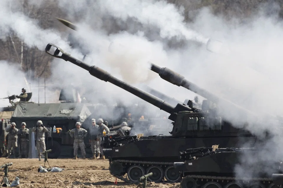 This file photo taken on 15 March 2012 shows US Army M109A6 Paladin self-propelled howitzers of the Second Infantry Division of the US Forces Korea attending a live firing drill at the US army's Rodriguez range in Pocheon, south of the demilitarised zone that divides the two Koreas. (Kim Hong-Ji /Pool/ AFP)