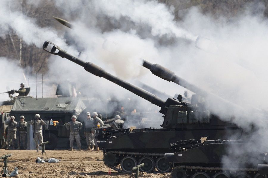 This file photo taken on 15 March 2012 shows US Army M109A6 Paladin self-propelled howitzers of the Second Infantry Division of the US Forces Korea attending a live firing drill at the US army's Rodriguez range in Pocheon, south of the demilitarised zone that divides the two Koreas. (Kim Hong-Ji /Pool/ AFP)