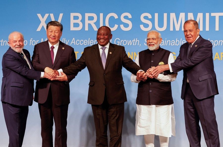 (From L to R) President of Brazil Luiz Inacio Lula da Silva, President of China Xi Jinping, South African President Cyril Ramaphosa, Prime Minister of India Narendra Modi and Russia's Foreign Minister Sergei Lavrov pose for a BRICS family photo during the 2023 BRICS Summit at the Sandton Convention Centre in Johannesburg on 23 August 2023.