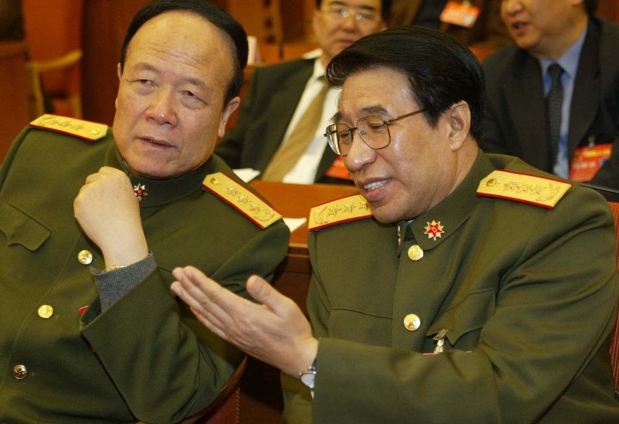 Two former CMC vice-chairs Guo Boxiong (left) and Xu Caihou at a session in the Great Hall of the People, Beijing, China, on 22 October 2007. (CNS)