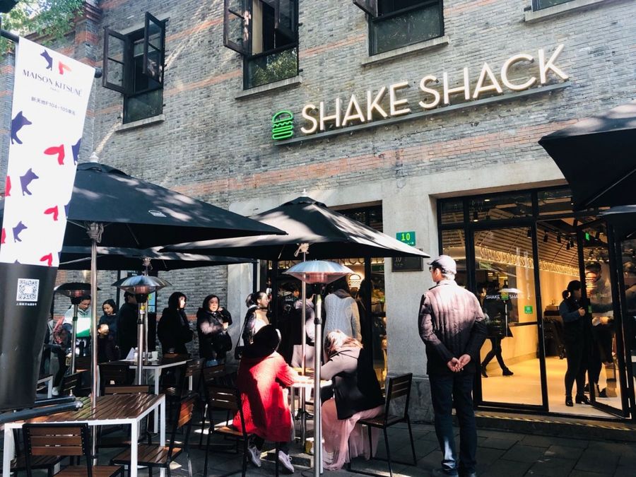 Queues form outside Shake Shack's first store in Shanghai.