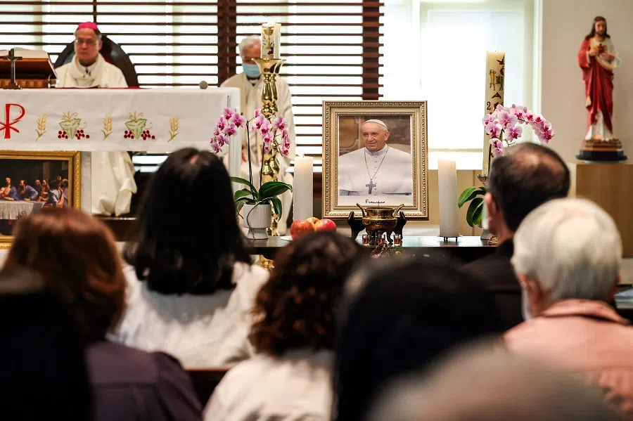 People gather to mourn the death of Pope Francis at a church of the Catholic Archdiocese of Taipei, in Taipei on 22 April 2025. (I-Hwa Cheng/AFP)