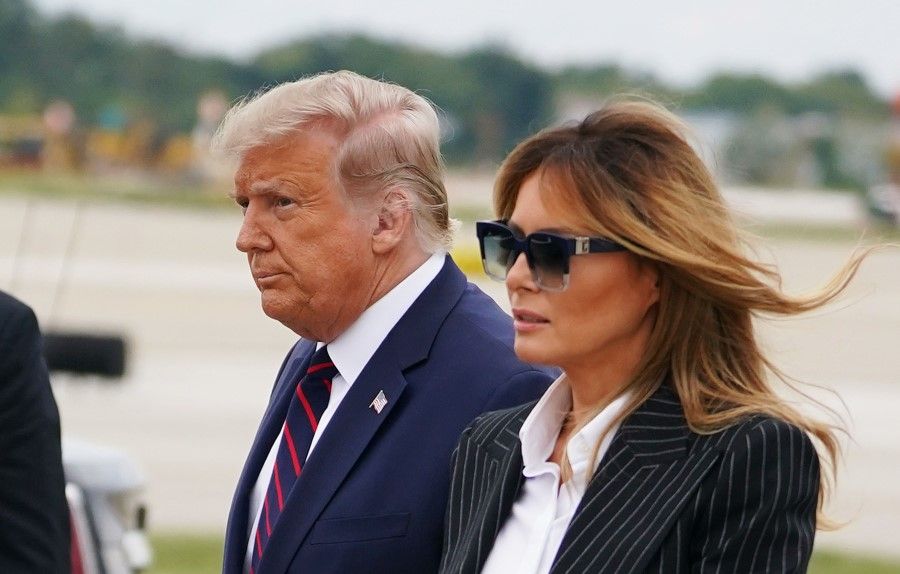 A 29 September 2020 photo shows US President Donald Trump and First Lady Melania Trump upon arrival at Cleveland Hopkins International Airport in Cleveland, Ohio where Trump will be taking part in the first presidential debate. President Donald Trump experienced only "mild symptoms" 2 October 2020 after contracting Covid-19, a top aide said. (Mandel Ngan/AFP)
