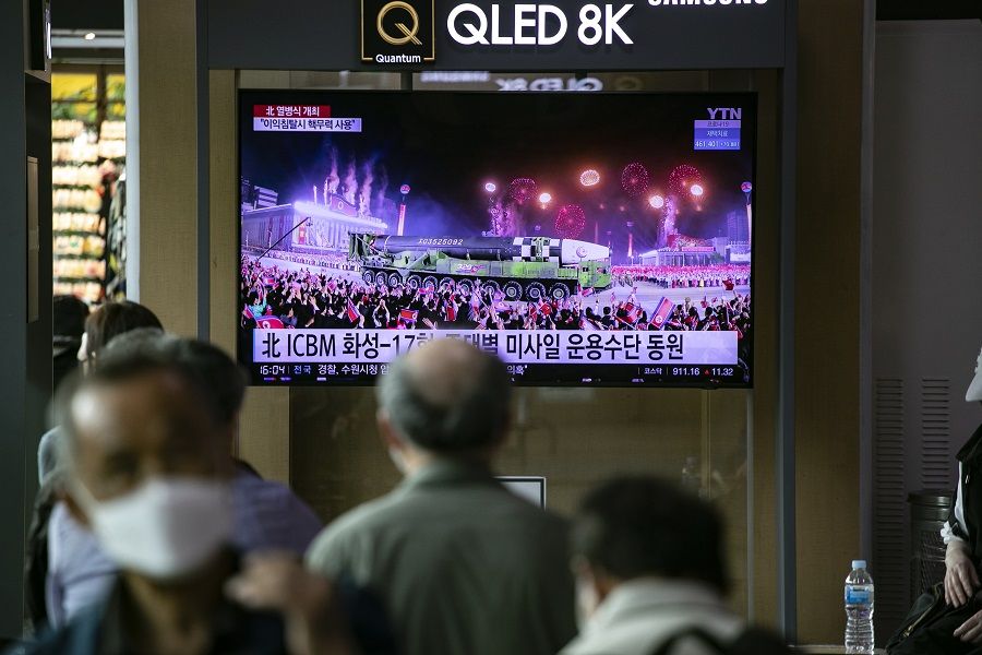 A news broadcast of a North Korean military parade, held on 25 April in Pyongyang, on a TV screen at Seoul Station in Seoul, South Korea, on 26 April 2022. (Woohae Cho/Bloomberg)