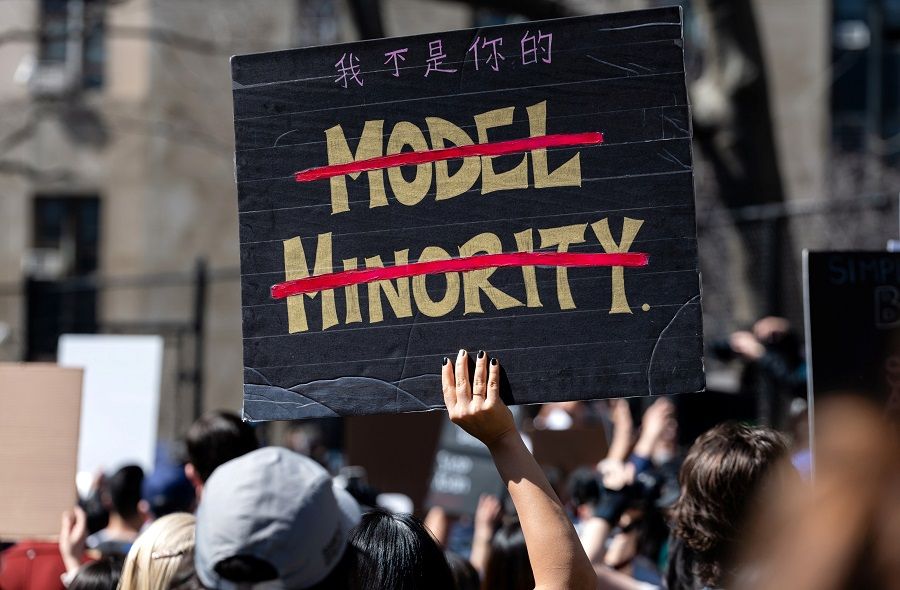 A person holds a sign during a rally against hate to end discrimination against Asian Americans and Pacific Islanders in New York City, US, 21 March 2021. (Eric Lee/Reuters)