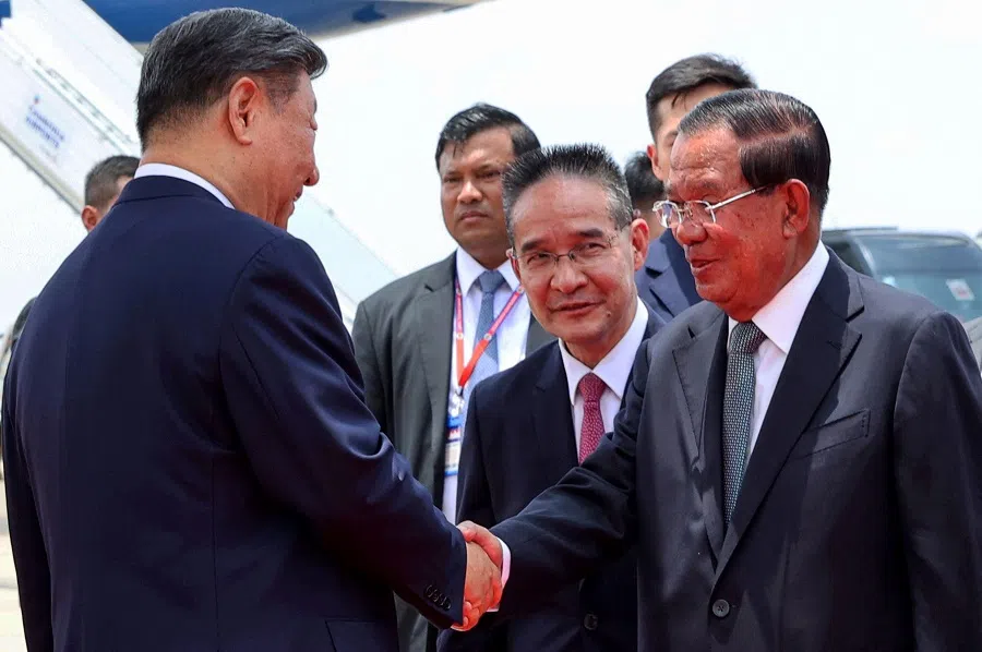 This pool photo taken and released on 17 April 2025 by Agence Kampuchea Presse (AKP) shows China’s President Xi Jinping (left) shaking hands with Cambodia’s Senate President Hun Sen (right) upon his arrival at Phnom Penh International Airport. (AFP)