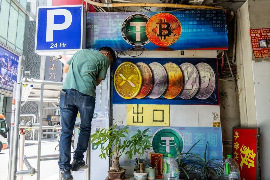A display of cryptocurrency logos at an exchange in Hong Kong, China, on 14 July 2025.