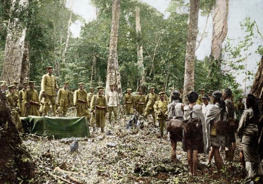 Japanese officers gathering compliant indigenous people, 1913.