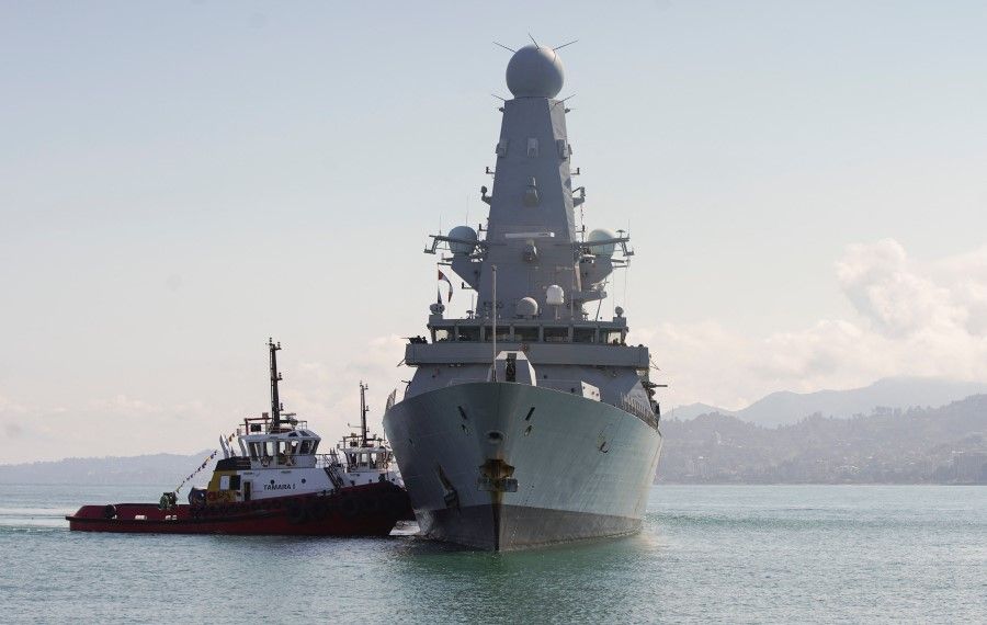 This handout photo taken on 26 June 2021 and released by the British embassy in Georgia, shows the British Royal Navy destroyer HMS Defender arrives in the Black Sea port of Batumi. (Irakli Gedenidze/AFP)