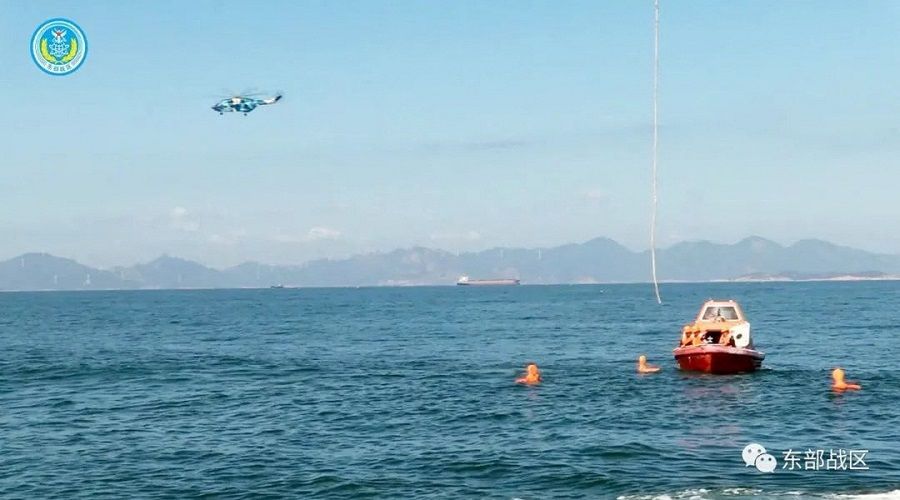 A helicopter and boat under the Eastern Theater Command of China's People's Liberation Army (PLA) take part in a maritime rescue drill, as part of military exercises in the waters around Taiwan, at an undisclosed location, on 9 August 2022, in this handout image released on 10 August 2022. (Eastern Theater Command/Handout via Reuters)