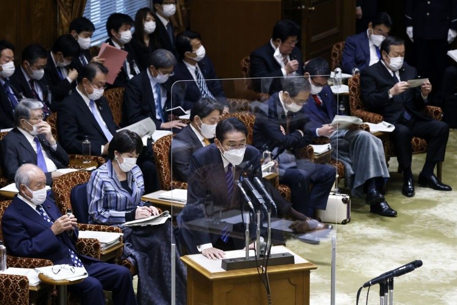 Japanese Prime Minister Fumio Kishida (centre) speaks at the upper house of parliament in Tokyo, Japan, on 1 December 2022. (Kiyoshi Ota/Bloomberg)