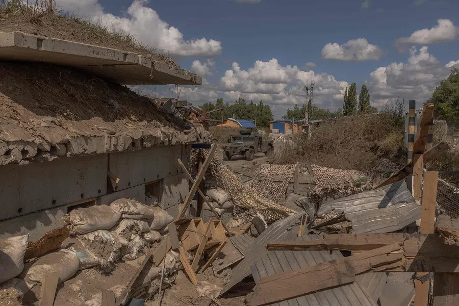 Ukrainian servicemen drive a Humvee military vehicle past a destroyed border crossing point with Russia, in the Sumy region, on 14 August 2024, amid the Russian invasion of Ukraine. (Roman Pilipey/AFP)