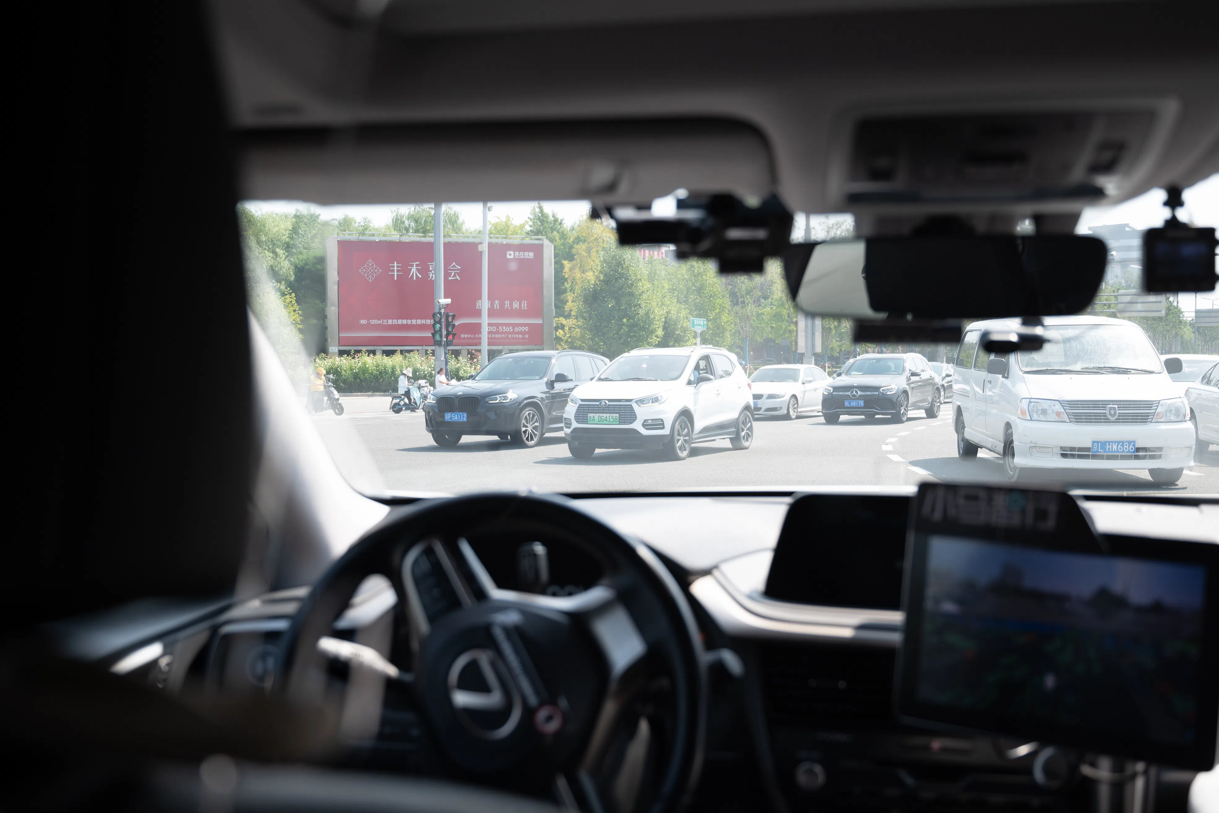 A fully driverless taxi (with no safety officer on board) by Pony.ai navigating a busy intersection in Yizhuang, Beijing on 14 September 2023. (SPH Media)