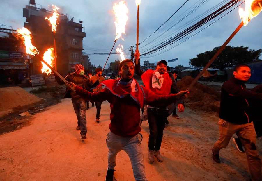 Students with torches protest against the alleged encroachment of Nepal border by India in far west of Nepal, in Kathmandu, Nepal, on 11 May 2020. (Navesh Chitrakar/Reuters)