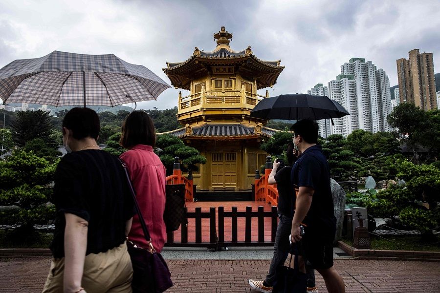 People walk through Nan Lian Garden in Hong Kong on 2 June 2022. (Isaac Lawrence/AFP)