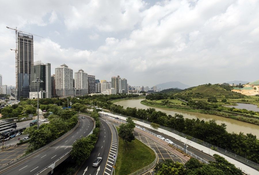 The Sham Chun river marking the border between Hong Kong, right, and Shenzhen is seen from Shenzhen, China, on 15 August 2019. (Qilai Shen/Bloomberg)