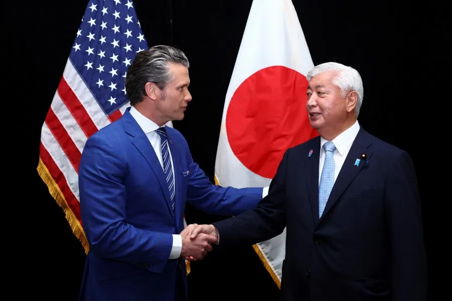 US Defence Secretary Pete Hegseth and Japan’s Defence Minister Gen Nakatani shake hands as they attend the IISS Shangri-La Dialogue security summit in Singapore, on 31 May 2025.