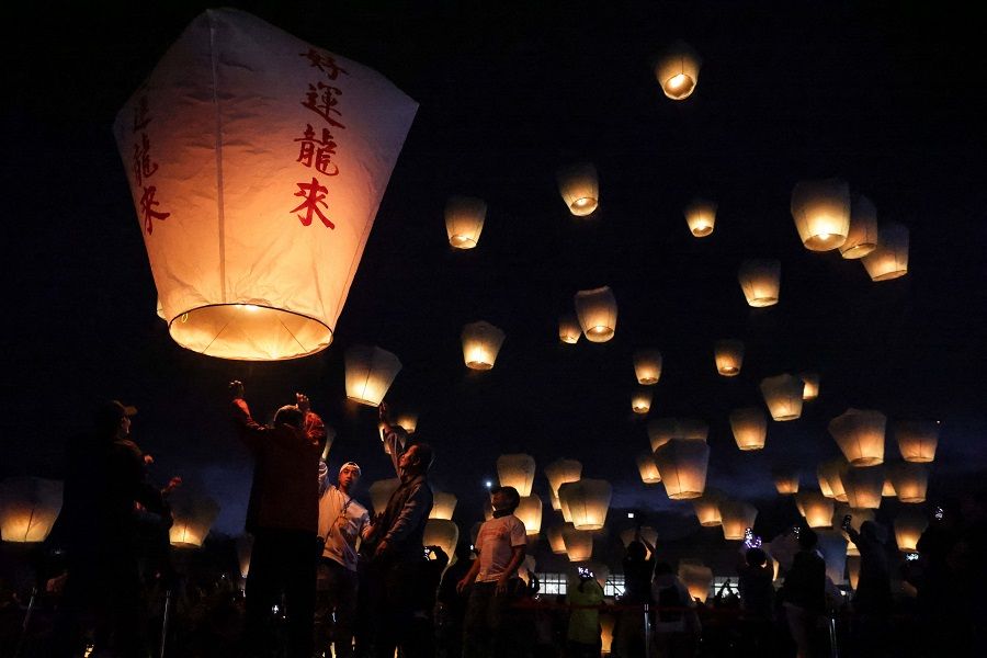 Tourists release sky lanterns during the Pingxi Lantern Festival in New Taipei City on 17 February 2024. (I-Hwa Cheng/AFP)