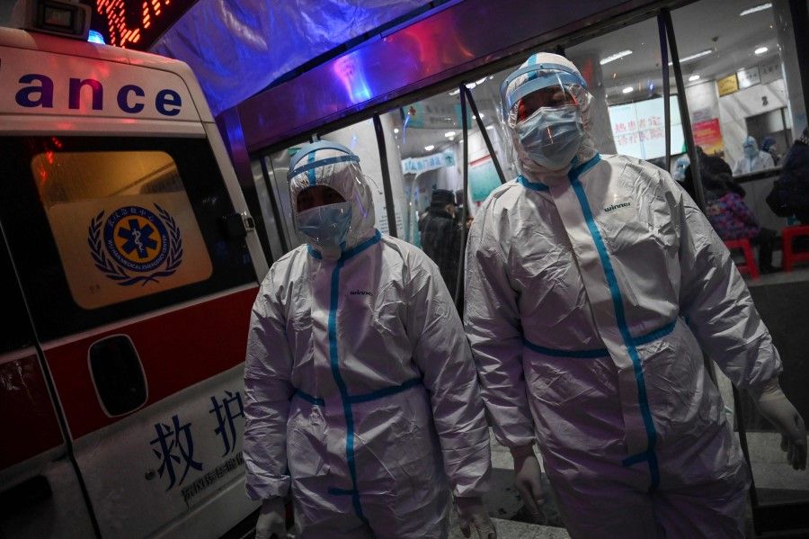 Medical staff members at the Wuhan Red Cross Hospital in Wuhan. The city's response to the Covid-19 outbreak has been less than satisfactory so far. (Hector Retamal/AFP)