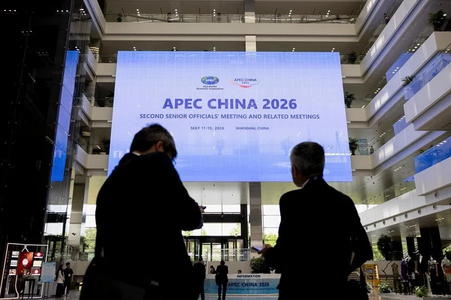 People walk at the Shanghai Expo Center ahead of the opening session of the APEC China 2026 Second Senior Officials' Meeting in Shanghai, China, on 18 May 2026.