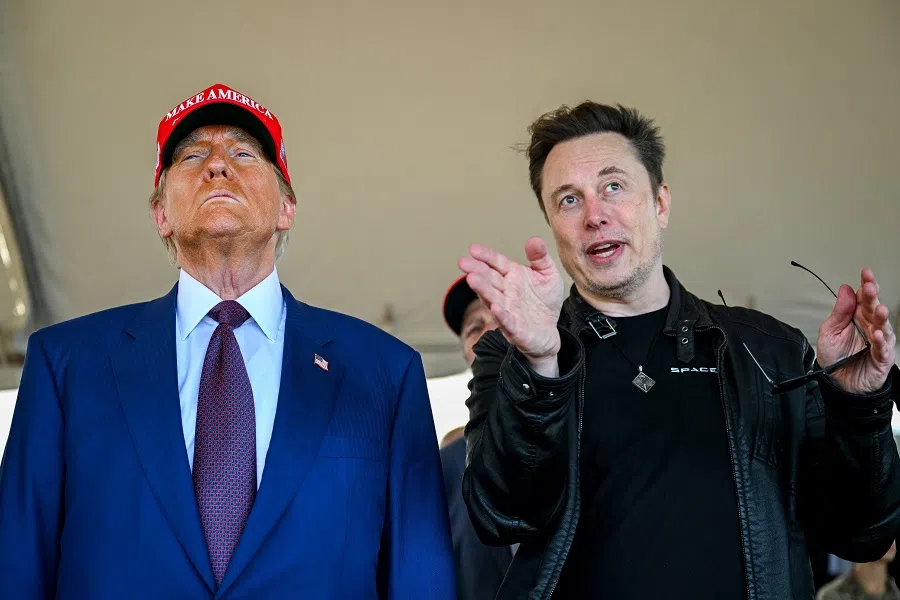 Elon Musk speaks with US President-elect Donald Trump as they watch the launch of the sixth test flight of the SpaceX Starship rocket in Brownsville, Texas, US, on 19 November 2024.