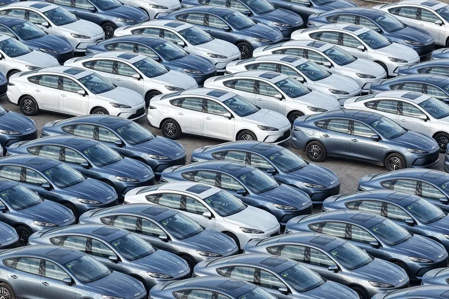 BYD cars are seen at a car storage yard before being loaded onto ships for export, in Yantai, in Chinas eastern Shandong province on 19 July 2026.
