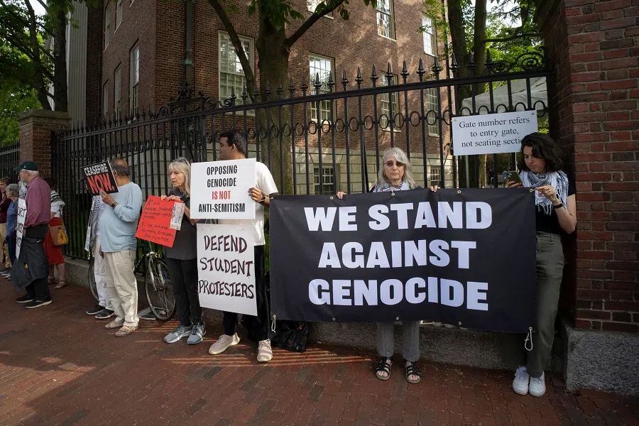 Pro-Palestinian demonstrators protest outside Harvard Yard during Harvard University’s class of 2024 graduation ceremony in Cambridge, Massachusetts on 23 May 2024.  (Rick Friedman/AFP)