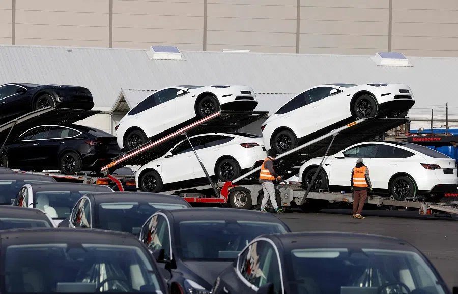 Cars are loaded on trucks outside the US carmaker Tesla’s German factory near Berlin, on 20 November 2024 in Gruenheide, eastern Germany. (Odd Andersen/AFP)