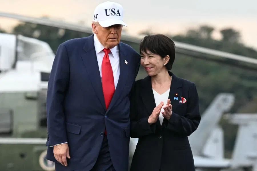 US President Donald Trump (left) and Japan’s Prime Minister Sanae Takaichi arrive on board the US Navy’s USS George Washington aircraft carrier at the US naval base in Yokosuka on 28 October 2025. (Andrew Caballero-Reynolds/AFP)