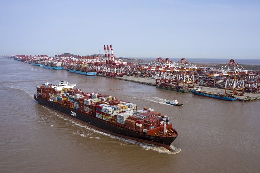 The ZIM Integrated Shipping Services Ltd. container ship sails out of the Yangshan Deep Water Port in this aerial photograph taken in Shanghai, China, on 23 March 2020. (Qilai Shen/Bloomberg)