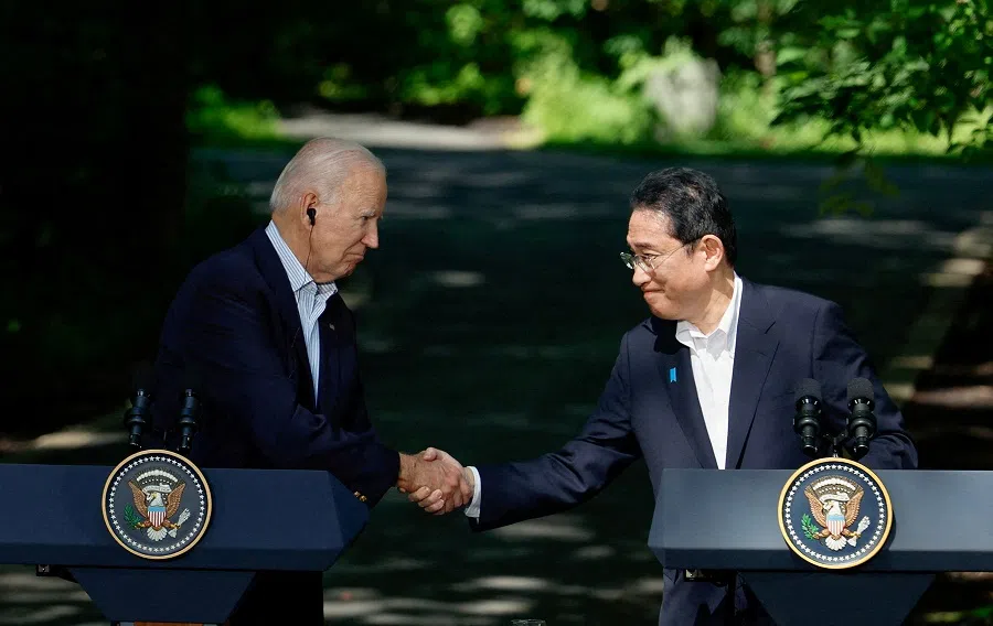 Japanese Prime Minister Fumio Kishida shakes hands with US President Joe Biden during a joint press conference with South Korean President Yoon Suk-yeol (not pictured) during the trilateral summit at Camp David near Thurmont, Maryland, US, on 18 August 2023. (Evelyn Hockstein/Reuters)