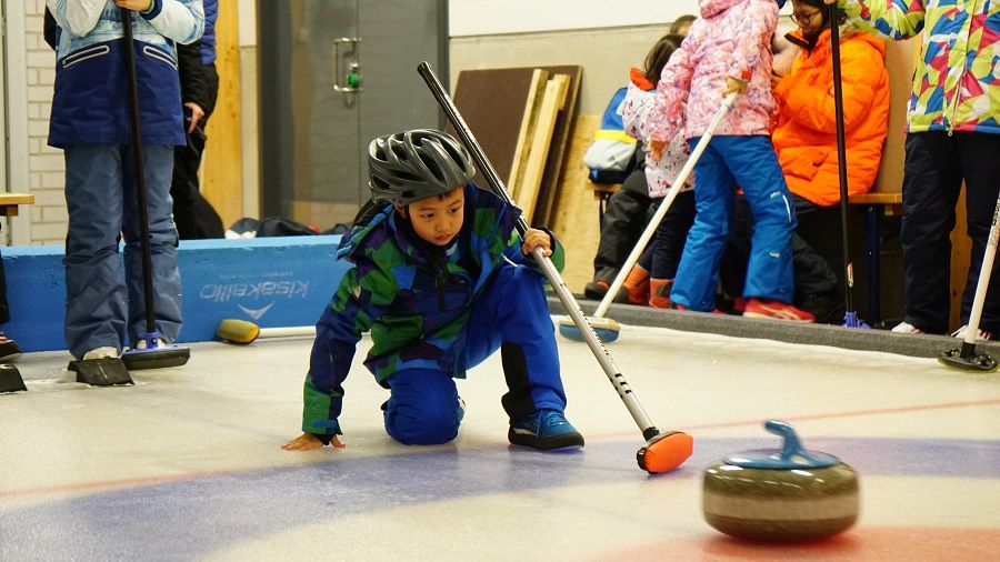Wang Guan's son learns curling during a study tour to Finland in 2019. (Photo provided by interviewee)
