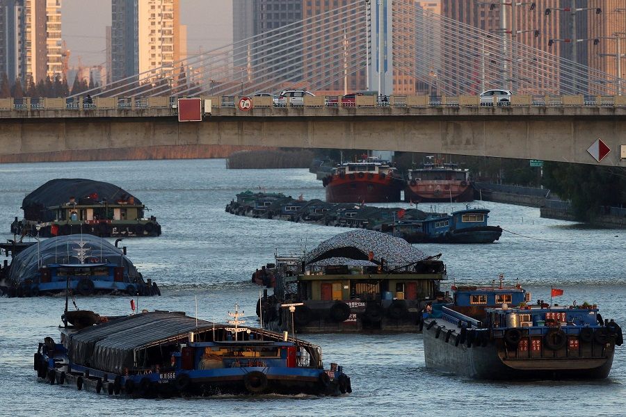 This photo taken on 22 November 2021 shows barges carrying coal on the Grand Canal in Huai'an, Jiangsu province, China. (AFP)