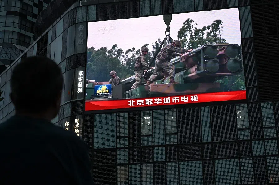 An outdoor screen shows a news coverage of China’s military drills around Taiwan, in Beijing, China, on 23 May 2024. (Jade Gao/AFP)