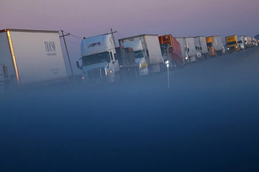 Trucks wait in a queue to cross into the US through the Jeronimo-Santa Teresa International Crossing, which connects the city of Ciudad Juarez with Santa Teresa, New Mexico, in Ciudad Juarez, Mexico, on 2 May 2024. (Jose Luis Gonzalez/Reuters)