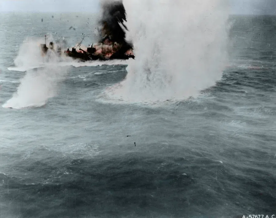 A Japanese corvette explodes after being hit by a B-25 bomber of the 345th Bombardment Group, Fifth Air Force, about 30 miles south of Xiamen, 6 April 1945. The explosive ripples in the water indicates the intensity of the bombing.