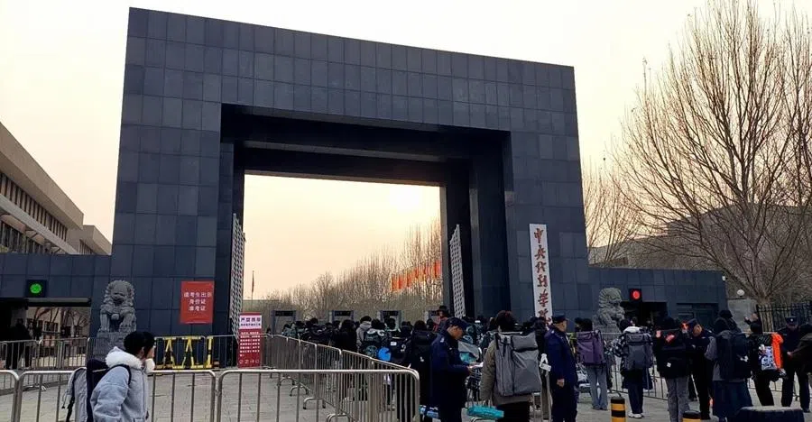 Yikao candidates queue outside the Central Academy of Drama in Beijing to sit for the school’s arts admissions exam, March 2026.