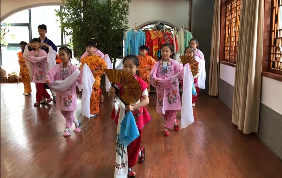 Elementary school students in Wuhan decked out in their performance outfits.