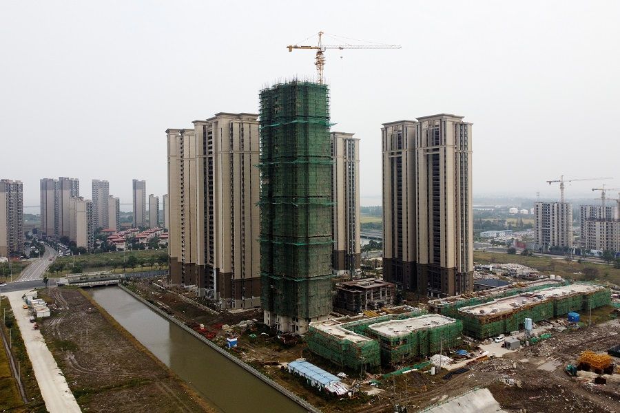 An aerial view shows residential buildings at the construction site of Evergrande Cultural Tourism City, a China Evergrande Group project whose construction has halted, in Taicang, Suzhou, Jiangsu province, China, 22 October 2021. (Xihao Jiang/Reuters)