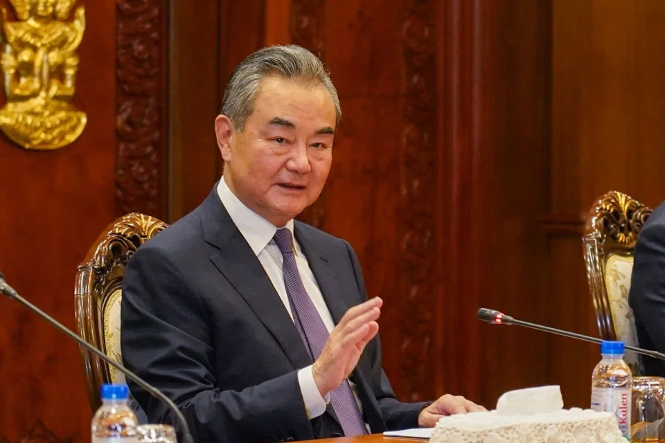 China's Foreign Minister Wang Yi gestures during a meeting with Cambodia's Foreign Minister Prak Sokhonn at the Cambodian Ministry of Foreign Affairs and International Cooperation in Phnom Penh on 13 August 2023. (AFP)