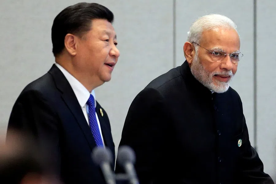 China’s President Xi Jinping and India’s Prime Minister Narendra Modi arrive for a signing ceremony during Shanghai Cooperation Organisation (SCO) summit in Qingdao, Shandong province, China, on 10 June 2018.