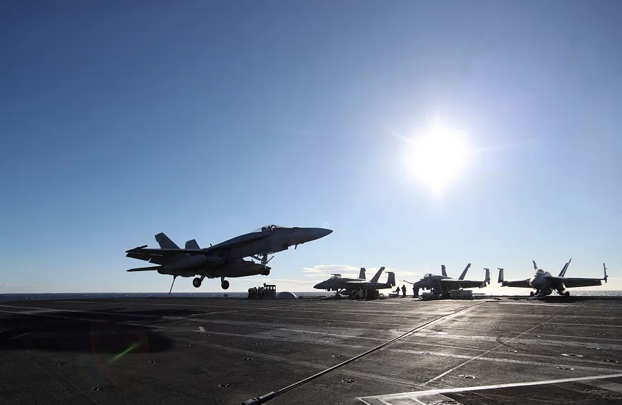 A military plane F/A-18 lands onboard aircraft carrier USS Harry S. Truman, in the Adriatic Sea, 2 February 2022. (Yara Nardi/Reuters)