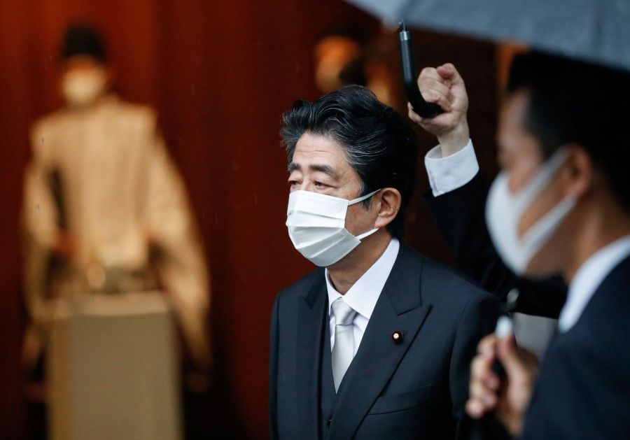 Former Japanese Prime Minister Shinzo Abe visits Yasukuni Shrine on the 76th anniversary of Japan's surrender in World War Two, amid the coronavirus disease (Covid-19) pandemic, in Tokyo, Japan, 15 August 2021. (Issei Kato/Reuters)