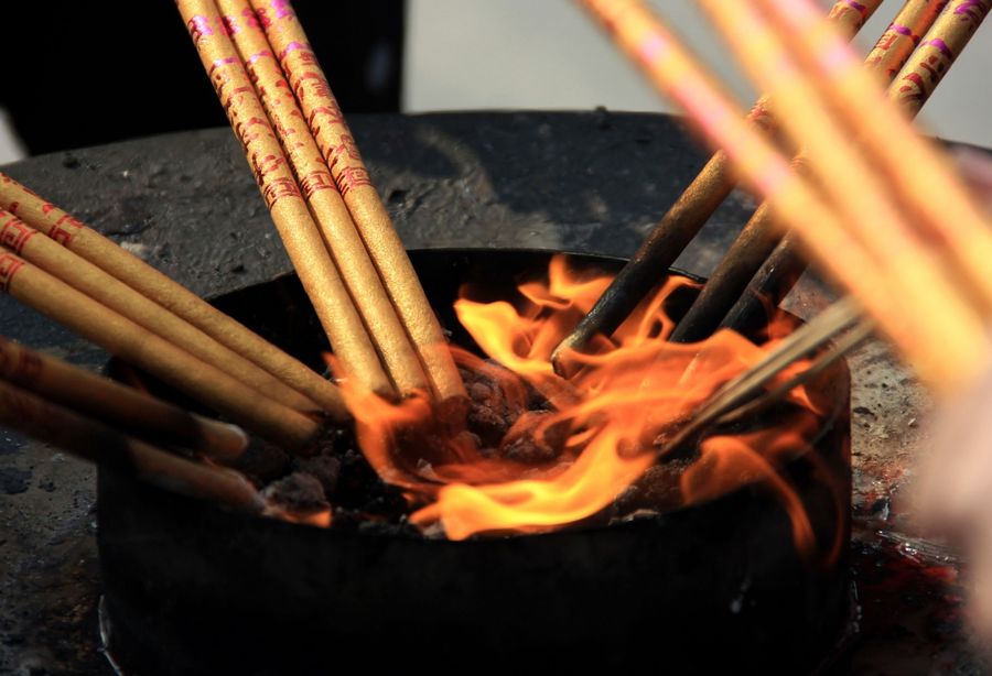 Spirituality is a fundamental part of human nature. This photo taken on 27 December 2019 shows people burning incense sticks as they offer prayers at the Longhua Temple in Shanghai. (Lan Lianchao/AFP)